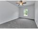Spacious bedroom featuring a ceiling fan and a window view at 535 Milus St, Punta Gorda, FL 33950