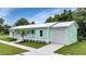 Charming home with a metal roof, a front porch, and a one-car garage at 535 Milus St, Punta Gorda, FL 33950