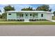 Inviting exterior view of a one-story home featuring a well-manicured lawn at 535 Milus St, Punta Gorda, FL 33950