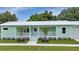 Inviting home exterior features a covered front porch at 535 Milus St, Punta Gorda, FL 33950