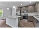 Modern kitchen with stainless steel appliances, island, and stylish cabinetry at 535 Milus St, Punta Gorda, FL 33950