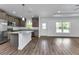 Open layout kitchen with modern appliances, a center island, and ample natural light at 535 Milus St, Punta Gorda, FL 33950