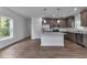 Spacious open-concept kitchen with a center island and modern stainless steel appliances at 535 Milus St, Punta Gorda, FL 33950