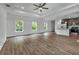 Open-concept living room with hardwood floors and a center island kitchen at 535 Milus St, Punta Gorda, FL 33950