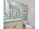 Cozy bathroom features a vanity, mirror and shower-tub combination with neutral color at 601 Shreve St # 62A, Punta Gorda, FL 33950