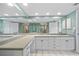 Bright bathroom with dual sinks, ample counter space, and large mirror at 601 Shreve St # 62A, Punta Gorda, FL 33950