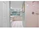 Tiled bathroom with a walk-in shower and a vanity with double sinks at 601 Shreve St # 62A, Punta Gorda, FL 33950