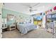 Light-filled bedroom with plush carpet, ceiling fan, and view of the outdoors at 601 Shreve St # 62A, Punta Gorda, FL 33950