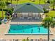Aerial view of the community pool and recreation area at Banyan Point featuring a sparkling pool at 601 Shreve St # 62A, Punta Gorda, FL 33950