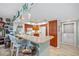 Cozy kitchen featuring a breakfast bar, wood cabinets, and a white refrigerator at 601 Shreve St # 62A, Punta Gorda, FL 33950
