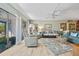 Bright living room with tile floors, ceiling fan, and sliding glass doors at 601 Shreve St # 62A, Punta Gorda, FL 33950
