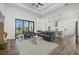 Bright living room featuring modern furnishings, recessed lighting, and wood-look flooring at 6235 Sheffield Ln, Englewood, FL 34224