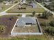 Aerial view of a fenced home with a private backyard surrounded by lush vegetation at 7095 Beardsley St, Englewood, FL 34224