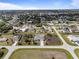 Aerial view of single-Gathering home within a residential community at 7095 Beardsley St, Englewood, FL 34224