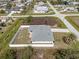 Aerial view of a fenced property featuring a well-maintained lawn and mature landscaping at 7095 Beardsley St, Englewood, FL 34224