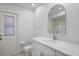 Bathroom with modern vanity, chrome fixtures, and shower at 7095 Beardsley St, Englewood, FL 34224