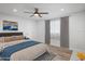 Cozy bedroom with natural light, ceiling fan, and plank flooring at 7095 Beardsley St, Englewood, FL 34224
