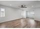 Spacious bedroom featuring wood-look floors, sliding glass doors and ample natural light at 7095 Beardsley St, Englewood, FL 34224