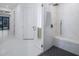 Contemporary bathroom with a glass shower and marble-style tiling at 9493 St Paul Dr, Port Charlotte, FL 33981