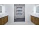 Elegant bathroom with double vanities and a spacious glass-enclosed shower at 9493 St Paul Dr, Port Charlotte, FL 33981