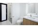 Stylish bathroom featuring a modern vanity, toilet, and glass-enclosed shower at 9493 St Paul Dr, Port Charlotte, FL 33981