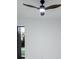 Modern bedroom featuring a contemporary ceiling fan, fresh white paint, and bright light at 9493 St Paul Dr, Port Charlotte, FL 33981