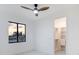 Cozy bedroom featuring a modern ceiling fan, lots of light, and a built-in wardrobe at 9493 St Paul Dr, Port Charlotte, FL 33981