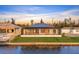 Waterfront home featuring a screened-in lanai and serene views of the adjacent waterway at 9493 St Paul Dr, Port Charlotte, FL 33981