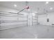 Spacious three-car garage with epoxy flooring and automatic door openers at 9493 St Paul Dr, Port Charlotte, FL 33981