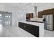 Bright, spacious kitchen featuring an island with bar seating and stainless steel appliances at 9493 St Paul Dr, Port Charlotte, FL 33981