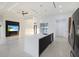 Open concept kitchen/living area with large island and a view of the water at 9493 St Paul Dr, Port Charlotte, FL 33981