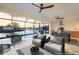Beautiful outdoor lanai with seating, outdoor kitchen and stunning views of the canal and sunset at 9493 St Paul Dr, Port Charlotte, FL 33981