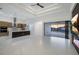 Bright, open-concept living space with modern finishes, recessed lighting, and seamless indoor-outdoor flow at 9493 St Paul Dr, Port Charlotte, FL 33981