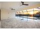 Large, screened-in pool area with beautiful canal views and neutral-toned pavers at 9493 St Paul Dr, Port Charlotte, FL 33981