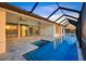 Beautiful screened-in pool with a spa, perfect for relaxation and outdoor entertaining at 9493 St Paul Dr, Port Charlotte, FL 33981