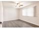 Bedroom with new floors, ceiling fan, and bright natural light from window at 1214 Ramsdel St, Port Charlotte, FL 33952