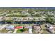 Wide aerial shot displaying the neighborhood and home, situated along a scenic waterway at 13632 Clara Ln, Port Charlotte, FL 33981
