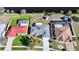 Overhead view of home revealing backyard space with neighboring properties and street access at 13632 Clara Ln, Port Charlotte, FL 33981