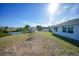 Spacious backyard with a shed, bordered by a canal, and a fenced pool at 13632 Clara Ln, Port Charlotte, FL 33981