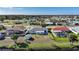 Aerial perspective highlighting well-maintained backyards with screened-in pools and waterfront access at 13632 Clara Ln, Port Charlotte, FL 33981