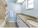Bathroom featuring double granite vanity, ceramic tile flooring and a tub and shower combo at 13632 Clara Ln, Port Charlotte, FL 33981