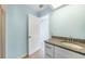 Bright bathroom with granite top vanity and tile flooring at 13632 Clara Ln, Port Charlotte, FL 33981