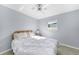 Serene bedroom featuring a ceiling fan, natural light, and stylish tiled floor at 13632 Clara Ln, Port Charlotte, FL 33981