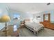 Charming bedroom featuring tiled floors, neutral colors, and abundant natural light at 13632 Clara Ln, Port Charlotte, FL 33981