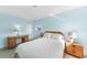Cozy bedroom with tiled floors, blue walls, and ample natural light at 13632 Clara Ln, Port Charlotte, FL 33981
