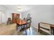 Traditional dining room with wood table and chairs and decorative china cabinet at 13632 Clara Ln, Port Charlotte, FL 33981