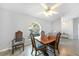 Dining room features tile floors and a picture window with natural light at 13632 Clara Ln, Port Charlotte, FL 33981