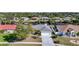 Well-maintained single Gathering home featuring a two-car garage and manicured lawn at 13632 Clara Ln, Port Charlotte, FL 33981