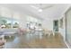 Bright and airy Florida room with tile flooring, multiple windows, and ample seating at 13632 Clara Ln, Port Charlotte, FL 33981