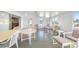 Bright sunroom with tile floors, plenty of natural light, and comfortable seating arrangements at 13632 Clara Ln, Port Charlotte, FL 33981